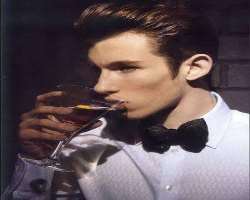 Callum Turner consuming alcohol